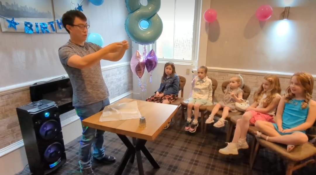Magic Yin performing a magic show for children at a birthday party